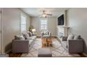 Cozy living room with ample seating, fireplace, and a neutral color palette at 2245 Dauphine St, Atlanta, GA 30344