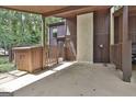 Attached carport featuring a storage shed with access to the home's entrance gate at 36 Cobblestone Crk, Peachtree City, GA 30269