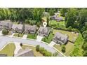Aerial view of a beautiful home with well-maintained landscaping in a quiet neighborhood at 4972 Park Vale Dr, Sugar Hill, GA 30518