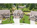 Aerial view of a beautiful home with well-maintained landscaping and a spacious backyard at 4972 Park Vale Dr, Sugar Hill, GA 30518