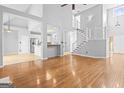 Spacious living room featuring hardwood floors and a staircase at 180 Rock Hill Dr, Fayetteville, GA 30215