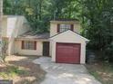 Inviting residence with a convenient attached garage and a private driveway for easy parking at 101 Pinetree Trl, Atlanta, GA 30349