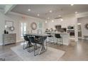 Open-concept kitchen featuring white cabinets, granite countertops, and stainless steel appliances at 313 Westfall Ter # 225A, Loganville, GA 30052