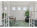Well-lit office with French doors, shiplap accent wall, and cozy seating area at 313 Westfall Ter # 225A, Loganville, GA 30052