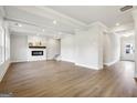 Bright and spacious living room with hardwood floors, fireplace, and abundant natural light at 504 Clayborne Way # 248A, Loganville, GA 30052