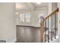 Open-concept living room features hardwood floors, wainscoting, and ample natural light at 714 Bristol Dr # 279A, Loganville, GA 30052