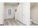 The entryway features luxury vinyl plank flooring, neutral paint, and a convenient powder room at 100 Avondale Blvd, Conyers, GA 30013
