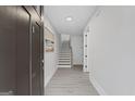 Bright foyer with hardwood floors, staircase, and an open layout at 101 Fairfield Nw Pl, Atlanta, GA 30314