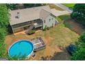 Aerial view of a home with a large deck, spacious yard, and above-ground pool at 116 Alexander Dr, Mcdonough, GA 30252