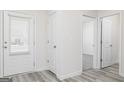 Bright hallway with wood-style flooring leading to other rooms in the home at 435 Prescott Way, Villa Rica, GA 30180