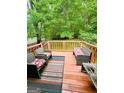 Cozy outdoor deck with comfortable seating perfect for relaxing and entertaining at 35 Hampton Oaks Dr, Hampton, GA 30228