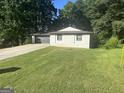Charming single-story home with manicured lawn and mature trees, perfect for suburban living at 6178 Graceland Cir, Morrow, GA 30260