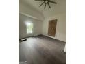 Bright bedroom with new flooring, a window, and fresh paint at 1551 Broad Ne St, Conyers, GA 30012