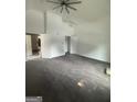 Spacious living room featuring fresh paint and a modern ceiling fan at 1551 Broad Ne St, Conyers, GA 30012