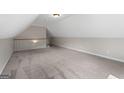 Spacious bonus room featuring neutral paint, and comfortable carpeting at 312 Cattlemans Cir, Mcdonough, GA 30252