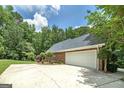This home features an oversized driveway leading to a spacious 2-car garage at 110 Chardonnay Oaks Dr, Mcdonough, GA 30252