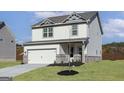 Inviting two-story home features a two-car garage, well-manicured lawn, and lovely curb appeal at 100 Cantrell Drive, Dallas, GA 30157