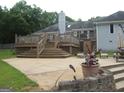 Amazing backyard with a large patio, tiered deck, and outdoor seating at 1455 River Cove Rd, Social Circle, GA 30025