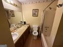 Bathroom featuring a vanity, toilet, and bathtub with shower at 6884 Red Maple Ct, Rex, GA 30273