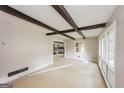 Bright living room with exposed beams and large windows for natural light at 2282 Belmont Dr, Decatur, GA 30032
