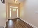 Inviting foyer with hardwood floors and a bright, welcoming front door at 40 Westbrook Rd, Carrollton, GA 30116