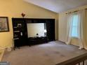 Cozy living room with built-in shelving, curtains, and natural light at 6875 Timberclair Ct, Lithonia, GA 30058