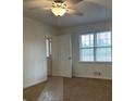 Well-lit bedroom with a ceiling fan and a window that fills the room with natural light at 110 Riley Ave, Fayetteville, GA 30214