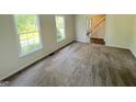 Spacious living room filled with natural light and plush carpet flooring throughout at 1875 Tree Brooke Ln, Snellville, GA 30078