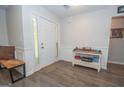 Welcoming foyer with hardwood floors, paneled walls, and a decorative console table at 65 Cold Harbor Ct, Sharpsburg, GA 30277