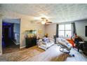 Comfortable living room with hardwood floors, bright windows, and cozy seating at 5804 Macedin Dr, Douglasville, GA 30135