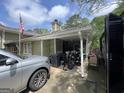 Home's covered parking area featuring space for vehicles, storage, and recreational equipment at 1791 Little Fawn Nw Trl, Conyers, GA 30012