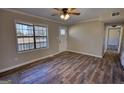 Spacious living area features ample natural light and modern flooring at 11 Grove Ln, Hampton, GA 30228