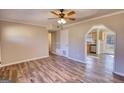 Open-concept living room boasts modern flooring and lots of natural light at 11 Grove Ln, Hampton, GA 30228
