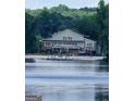 Gorgeous lake house features a private dock and spacious outdoor living areas at 2527 Amalfi Dr, Conyers, GA 30012