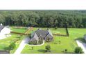 A home with a beautifully landscaped yard and a fenced in backyard at 116 Standford Dr, Mcdonough, GA 30252