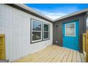 Inviting porch with blue door and stylish gray trim, perfect for relaxing at 1 Lamar Ave Sw, Atlanta, GA 30310
