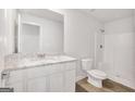 Clean, modern bathroom with white cabinets, granite countertop, toilet, and shower, ideal for comfortable living at 1184 Bluecoat Cir # 84, Hampton, GA 30228