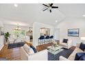 Bright open concept living room features hardwood floors and views into kitchen with breakfast bar at 1675 Brewer Sw Blvd, Atlanta, GA 30310