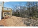 The backyard features a deck overlooking a spacious yard with plenty of trees at 257 Orwell Drive Lot 48 # 48, Social Circle, GA 30025