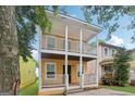 Charming home with double porches offering outdoor living space and neighborhood views at 1159 Smith Sw St, Atlanta, GA 30310
