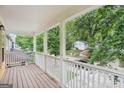 Cozy covered porch providing a relaxing outdoor space with views of the quiet neighborhood at 1159 Smith Sw St, Atlanta, GA 30310