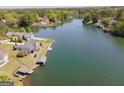 Panoramic aerial view showcasing lakeside homes with private docks at 1252 Heritage Dr, Villa Rica, GA 30180