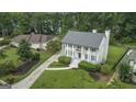 Charming two-story home featuring a manicured front yard and inviting curb appeal at 107 Edgewater Way, Peachtree City, GA 30269