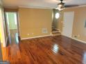 Inviting living room showcases beautiful hardwood floors and natural light at 424 Ivey Edwards Ln, Mcdonough, GA 30253