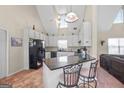 Bright kitchen with vaulted ceilings, granite counters, breakfast bar and seating at 603 Rossie Court, Mcdonough, GA 30252