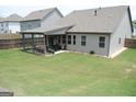 Spacious backyard featuring a covered patio, perfect for outdoor entertaining and relaxation at 4605 Dandelion Way, Cumming, GA 30040