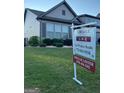 Well-maintained home with a 'For Sale' sign, offering a fantastic opportunity for prospective buyers at 4605 Dandelion Way, Cumming, GA 30040