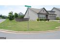 Well maintained home with a manicured lawn on a corner lot at the intersection of two quiet residential streets at 4605 Dandelion Way, Cumming, GA 30040