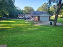 Brick home with a two-car garage and well-manicured lawn at 3211 Rockview Dr, Lithonia, GA 30038