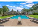 Backyard with a diving pool, patio and expansive yard perfect for entertaining or relaxing at 396 Ebenezer Rd, Fayetteville, GA 30215